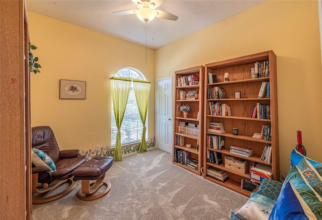 5929 Meadowcrest Ln, Sachse, TX 75048 - sitting room featuring a ceiling fan, carpet, and a textured ceiling