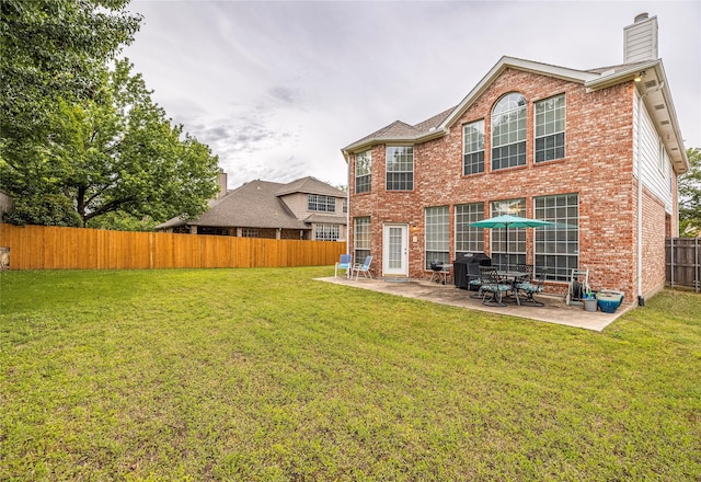 5929 Meadowcrest Ln, Sachse, TX 75048 - rear view of property with a patio area, brick siding, and a chimney
