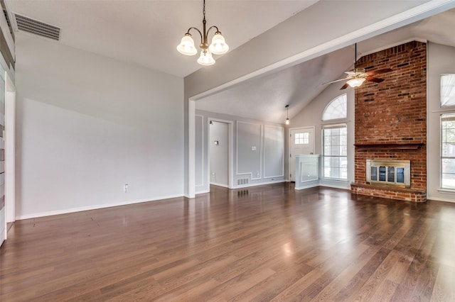 unfurnished living room featuring a chandelier, ceiling fan, wood finished floors, high vaulted ceiling, and a fireplace