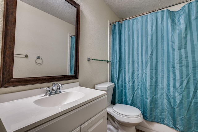 bathroom featuring a textured ceiling, toilet, vanity, a textured wall, and shower / tub combo