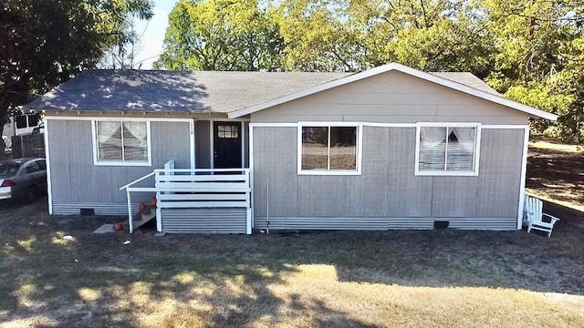 110 S Alma Ave, Kerens, TX 75144 - rear view of property with a lawn and a shingled roof
