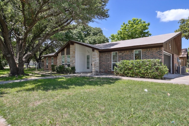 404 Anita Ave, Keller, TX 76248 - mid-century modern home featuring a garage, a front yard, brick siding, stone siding, and central AC unit