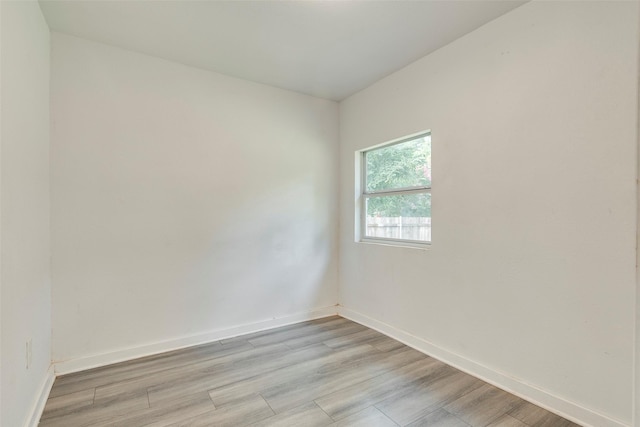 4423 Colonial Ave, Dallas, TX 75215 - empty room with baseboards and light wood-type flooring
