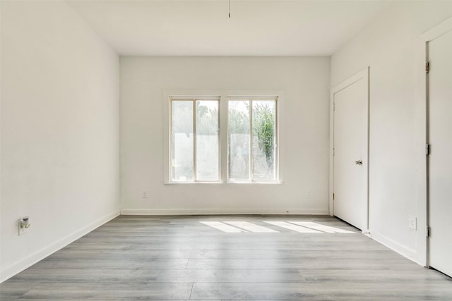 4423 Colonial Ave, Dallas, TX 75215 - unfurnished bedroom with wood finished floors and baseboards
