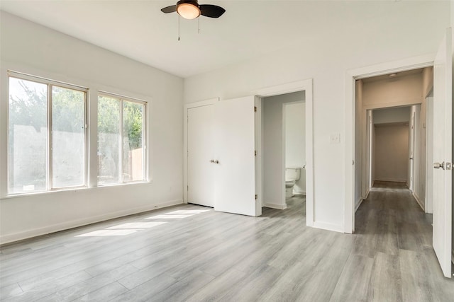 4423 Colonial Ave, Dallas, TX 75215 - unfurnished bedroom with light wood-type flooring, baseboards, and ceiling fan