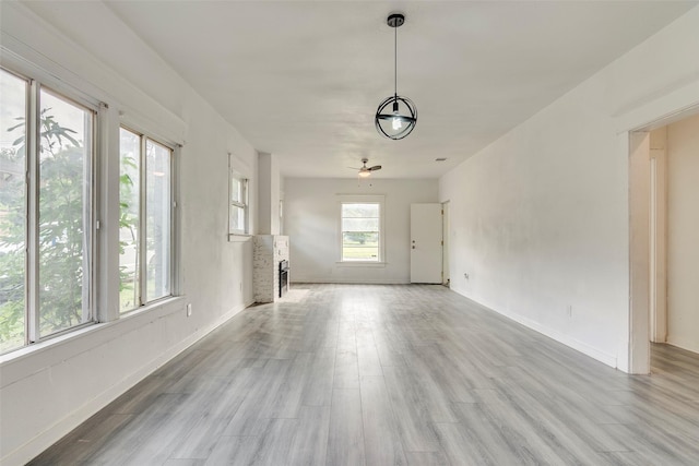 4423 Colonial Ave, Dallas, TX 75215 - unfurnished living room featuring light wood finished floors and baseboards
