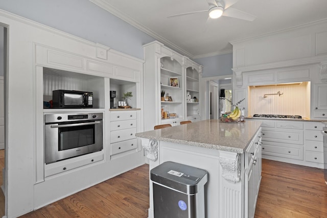229 College, Italy, TX 76651 - kitchen with stainless steel appliances, crown molding, dark wood-type flooring, ceiling fan, and white cabinets