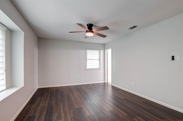 7824 Daniel Dr, North Richland Hills, TX 76182 - spare room featuring dark wood-style floors, a ceiling fan, and baseboards