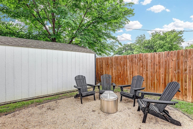 7824 Daniel Dr, North Richland Hills, TX 76182 - view of patio with a storage unit, an outdoor structure, and fence