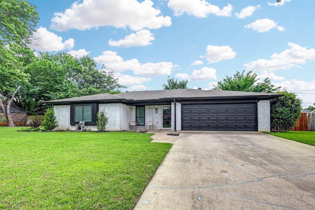 7824 Daniel Dr, North Richland Hills, TX 76182 - view of front of house featuring brick siding, a garage, and concrete driveway