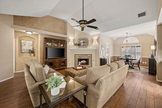 4252 Millview Ln, Dallas, TX 75287 - living area featuring lofted ceiling, a ceiling fan, baseboards, a warm lit fireplace, and dark wood finished floors
