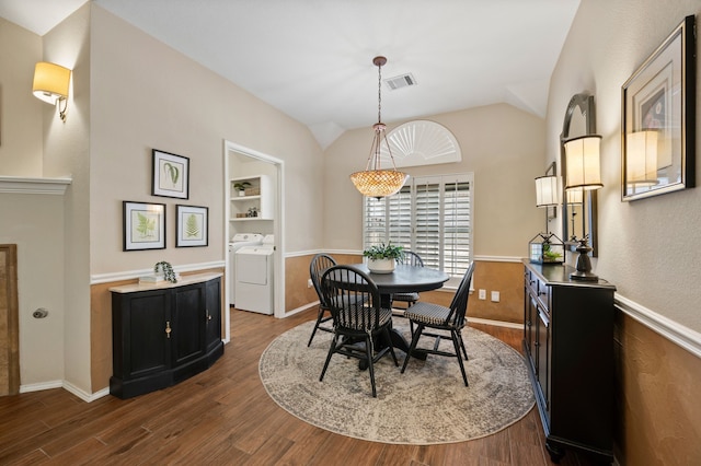 4252 Millview Ln, Dallas, TX 75287 - dining space featuring washing machine and clothes dryer, dark wood finished floors, lofted ceiling, built in features, and baseboards