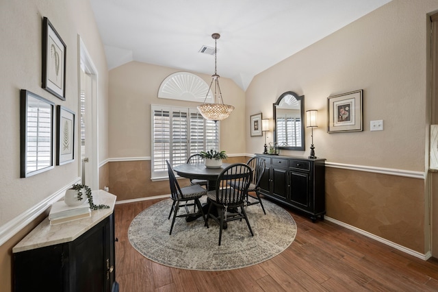 4252 Millview Ln, Dallas, TX 75287 - dining area featuring plenty of natural light, vaulted ceiling, dark wood-style flooring, and baseboards