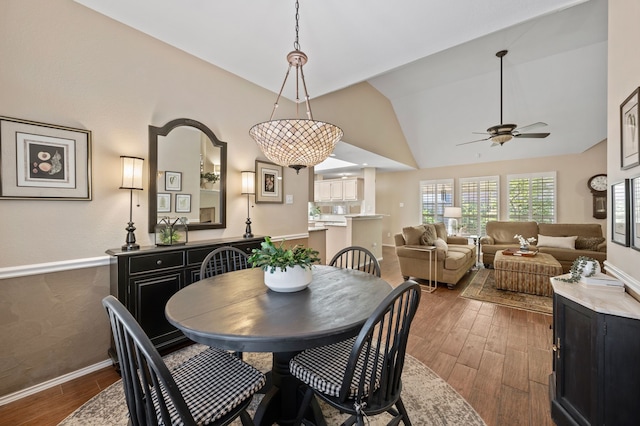 4252 Millview Ln, Dallas, TX 75287 - dining area featuring ceiling fan, dark wood-style flooring, lofted ceiling, and baseboards