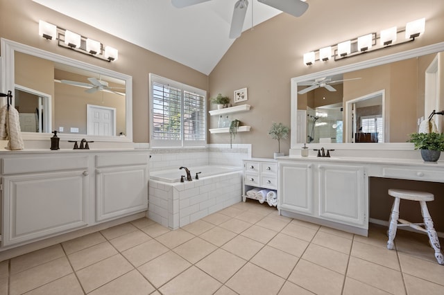 4252 Millview Ln, Dallas, TX 75287 - full bath with a ceiling fan, tile patterned floors, vaulted ceiling, and two vanities