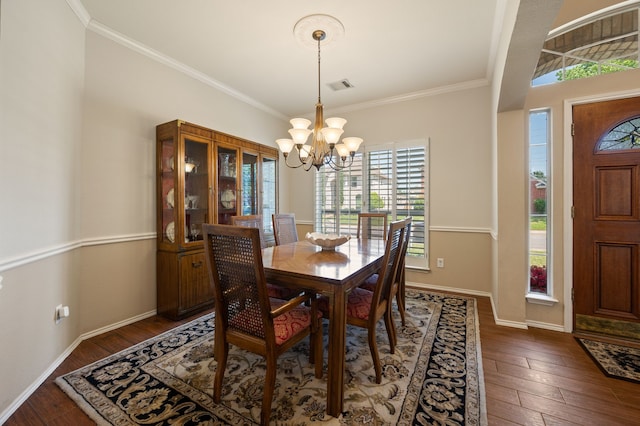 4252 Millview Ln, Dallas, TX 75287 - dining room with a chandelier, dark wood-type flooring, crown molding, and baseboards