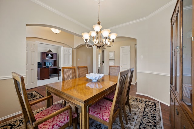 4252 Millview Ln, Dallas, TX 75287 - dining room with arched walkways, a chandelier, wood finished floors, crown molding, and baseboards