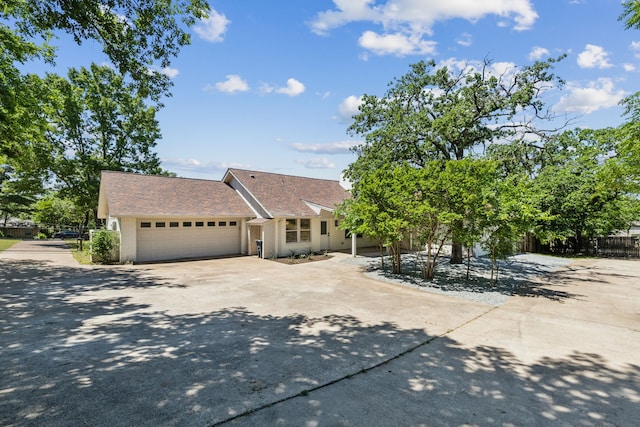 1000 Texas Trl, Keller, TX 76262 - view of front of home featuring concrete driveway, a garage, fence, and a shingled roof