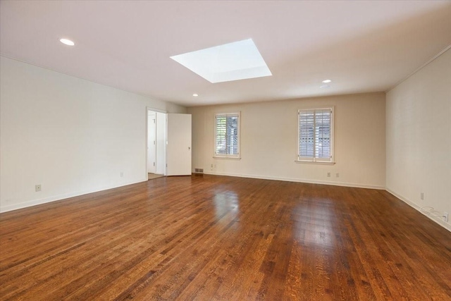 2900 Simondale Dr, Fort Worth, TX 76109 - spare room featuring a skylight, wood finished floors, recessed lighting, and baseboards