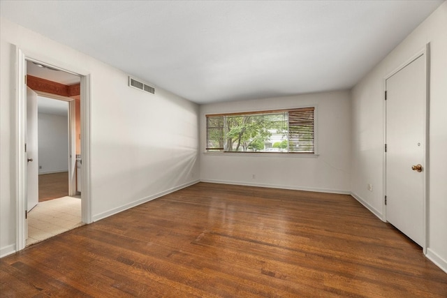 2900 Simondale Dr, Fort Worth, TX 76109 - unfurnished bedroom with wood finished floors and baseboards