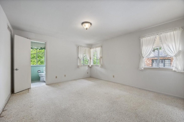 2900 Simondale Dr, Fort Worth, TX 76109 - empty room featuring plenty of natural light, baseboards, and carpet flooring