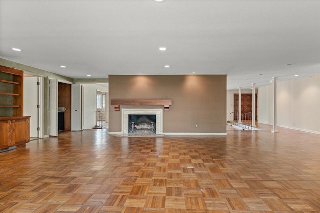 2900 Simondale Dr, Fort Worth, TX 76109 - unfurnished living room featuring a high end fireplace, baseboards, and recessed lighting