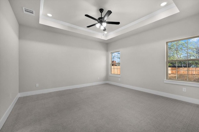 4405 Baylor St, Fort Worth, TX 76119 - carpeted spare room featuring a raised ceiling, crown molding, healthy amount of natural light, ceiling fan, and recessed lighting