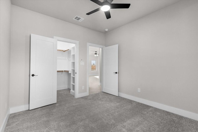 4405 Baylor St, Fort Worth, TX 76119 - unfurnished bedroom with carpet floors, a walk in closet, baseboards, and a closet