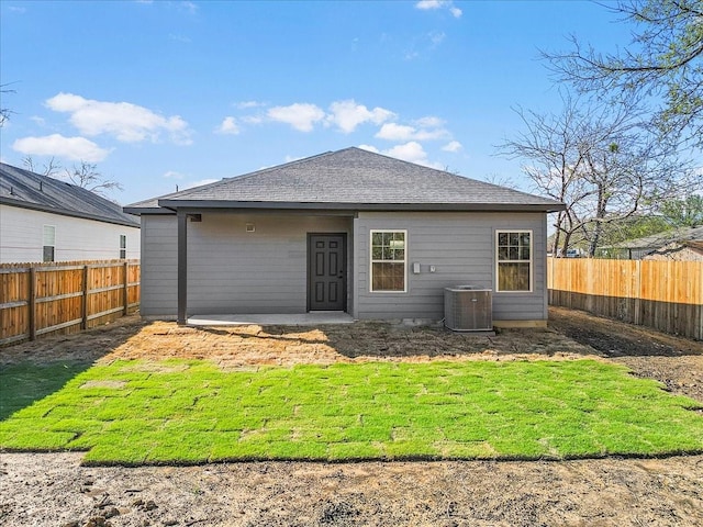 4405 Baylor St, Fort Worth, TX 76119 - rear view of house featuring cooling unit and roof with shingles