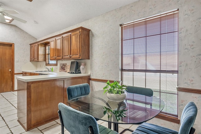 17881 Silver Leaf, Flint, TX 75762 - dining area featuring wallpapered walls, vaulted ceiling, ceiling fan, and light tile patterned floors