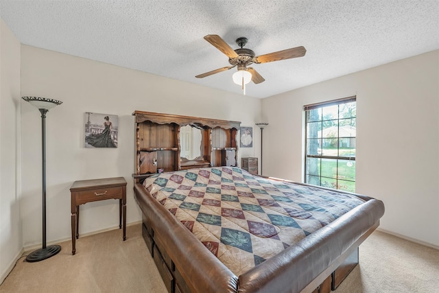 17881 Silver Leaf, Flint, TX 75762 - bedroom featuring light colored carpet, a textured ceiling, baseboards, and ceiling fan