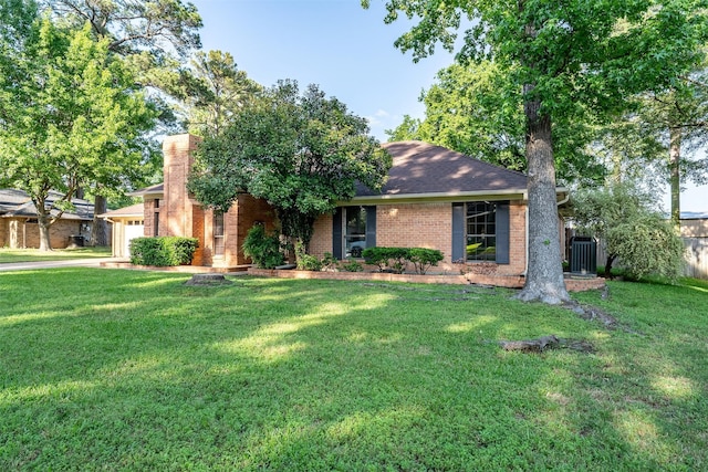 17881 Silver Leaf, Flint, TX 75762 - ranch-style house featuring central AC unit, brick siding, an attached garage, driveway, and a chimney