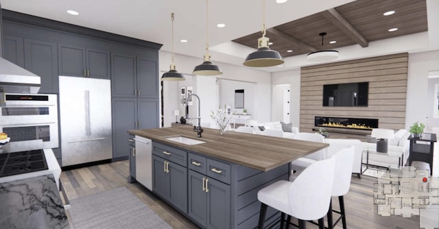 TBDSinclair Latigo Way, Weatherford, TX 76088 - kitchen with a sink, open floor plan, dark wood-type flooring, white appliances, and a kitchen breakfast bar