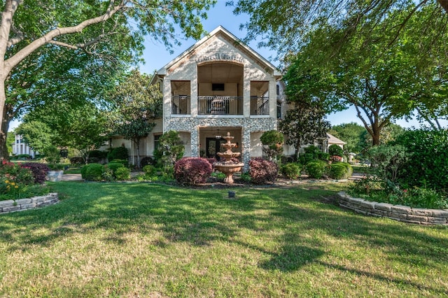 2032 Cains Ln, Mansfield, TX 76063 - view of front of property featuring a balcony, stone siding, a front yard, and brick siding