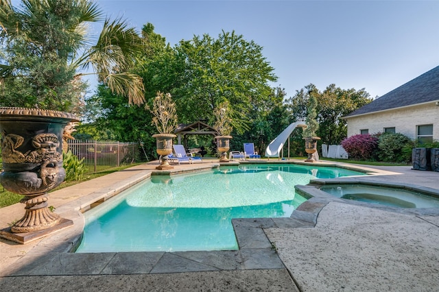 2032 Cains Ln, Mansfield, TX 76063 - view of swimming pool with a water slide, a patio, and a pool with connected hot tub