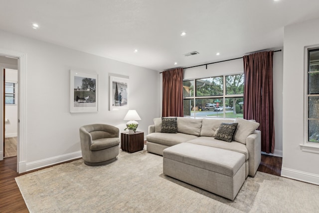 3351 Santa Teresa Ave, Dallas, TX 75228 - living area featuring baseboards, wood finished floors, and recessed lighting