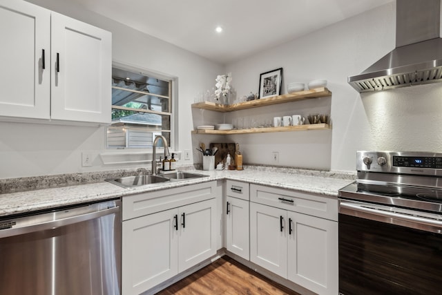 3351 Santa Teresa Ave, Dallas, TX 75228 - kitchen featuring stainless steel appliances, wall chimney range hood, a sink, white cabinetry, and light stone countertops