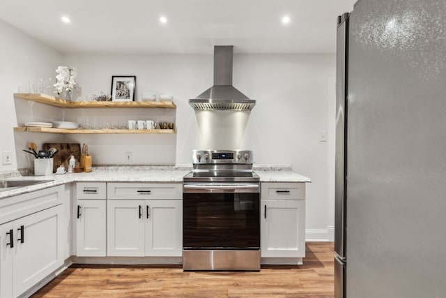 3351 Santa Teresa Ave, Dallas, TX 75228 - kitchen with stainless steel appliances, wall chimney range hood, light wood finished floors, open shelves, and light stone counters