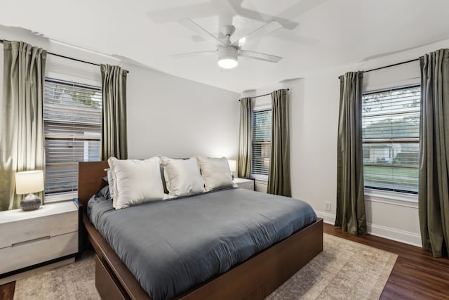 3351 Santa Teresa Ave, Dallas, TX 75228 - bedroom featuring multiple windows, wood finished floors, baseboards, and a ceiling fan