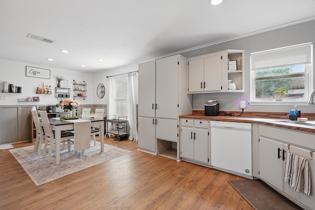 4602 Marlboro Dr, Abilene, TX 79606 - kitchen featuring dishwasher, recessed lighting, a sink, white cabinets, and light wood-type flooring