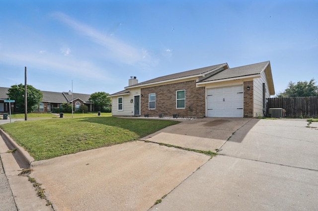 4602 Marlboro Dr, Abilene, TX 79606 - ranch-style home featuring brick siding, a garage, driveway, a chimney, and cooling unit