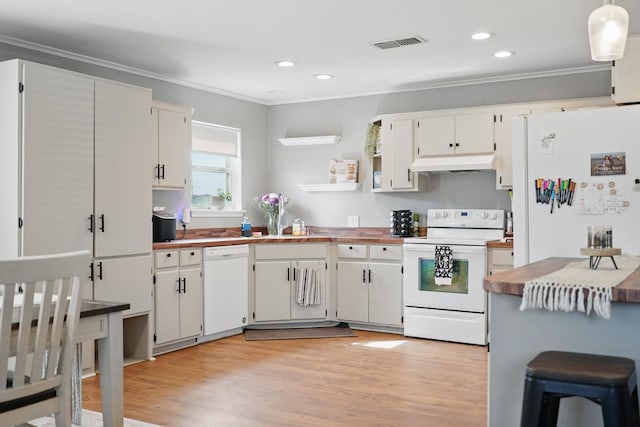 4602 Marlboro Dr, Abilene, TX 79606 - kitchen with white appliances, crown molding, under cabinet range hood, light wood-style floors, and white cabinetry