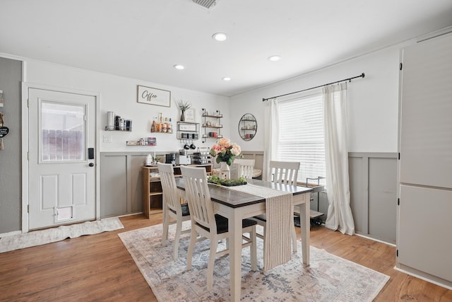 4602 Marlboro Dr, Abilene, TX 79606 - dining space with healthy amount of natural light, wainscoting, light wood-type flooring, crown molding, and recessed lighting