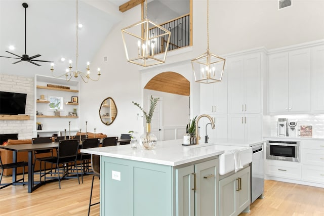 2410 Somercrest Pl, Midlothian, TX 76065 - kitchen featuring a chandelier, high vaulted ceiling, appliances with stainless steel finishes, a sink, and a center island with sink