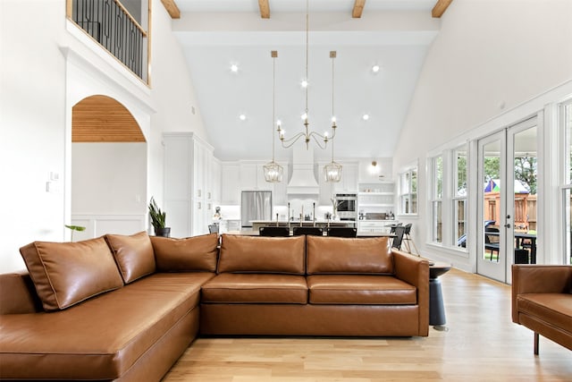 2410 Somercrest Pl, Midlothian, TX 76065 - living room with high vaulted ceiling, beamed ceiling, light wood-type flooring, a chandelier, and french doors