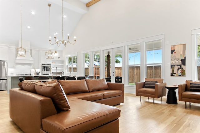 2410 Somercrest Pl, Midlothian, TX 76065 - living room with high vaulted ceiling, light wood-style floors, beamed ceiling, a chandelier, and healthy amount of natural light