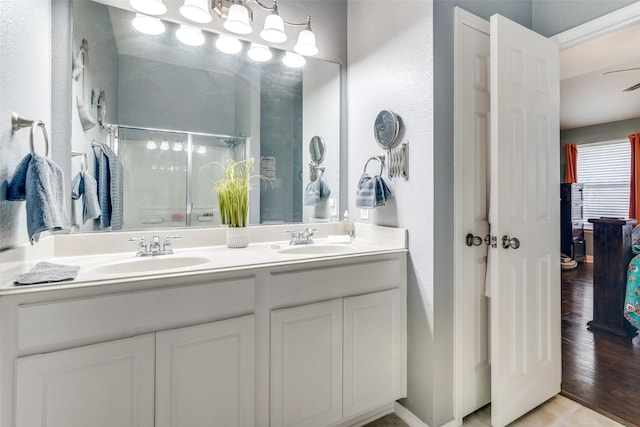 4002 Silver Lake Trl, Heartland, TX 75126 - bathroom featuring a stall shower, a textured wall, and double vanity