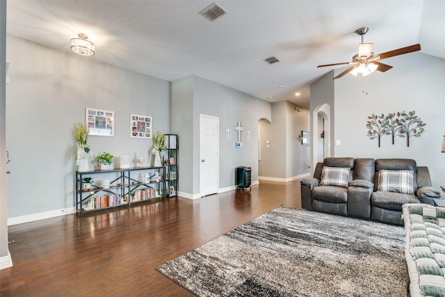 4002 Silver Lake Trl, Heartland, TX 75126 - living room featuring arched walkways, a ceiling fan, wood finished floors, baseboards, and lofted ceiling