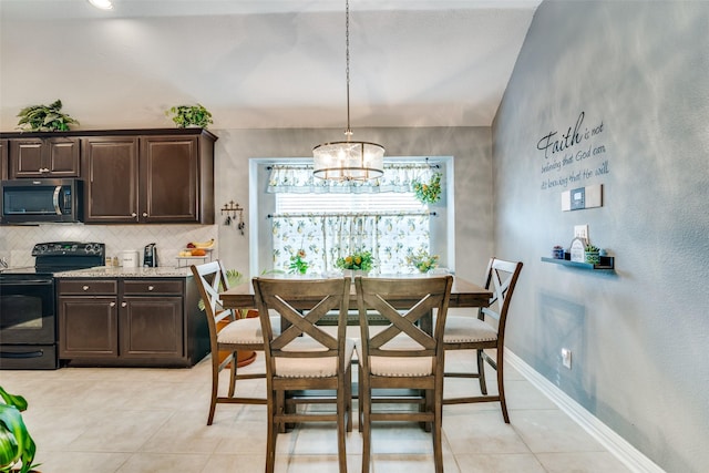 4002 Silver Lake Trl, Heartland, TX 75126 - dining area featuring light tile patterned floors, a chandelier, vaulted ceiling, and baseboards