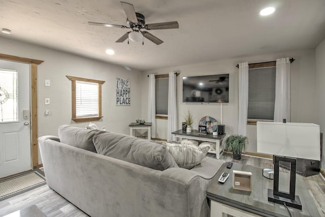179 Oak St, Nocona, TX 76255 - living room with a ceiling fan, light wood-style flooring, and recessed lighting